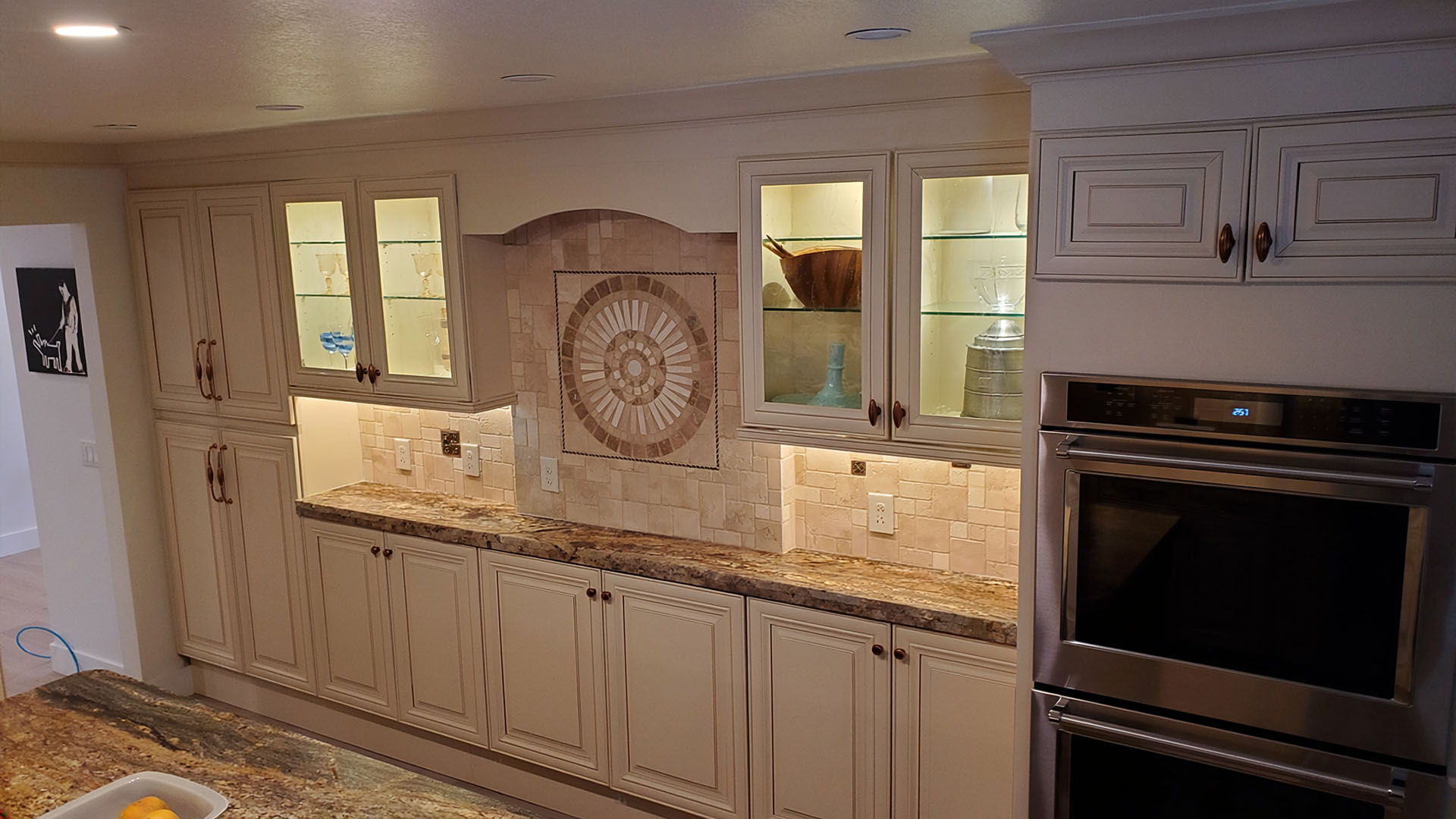 custom kitchen cabinetry with lighted glass display cabinets