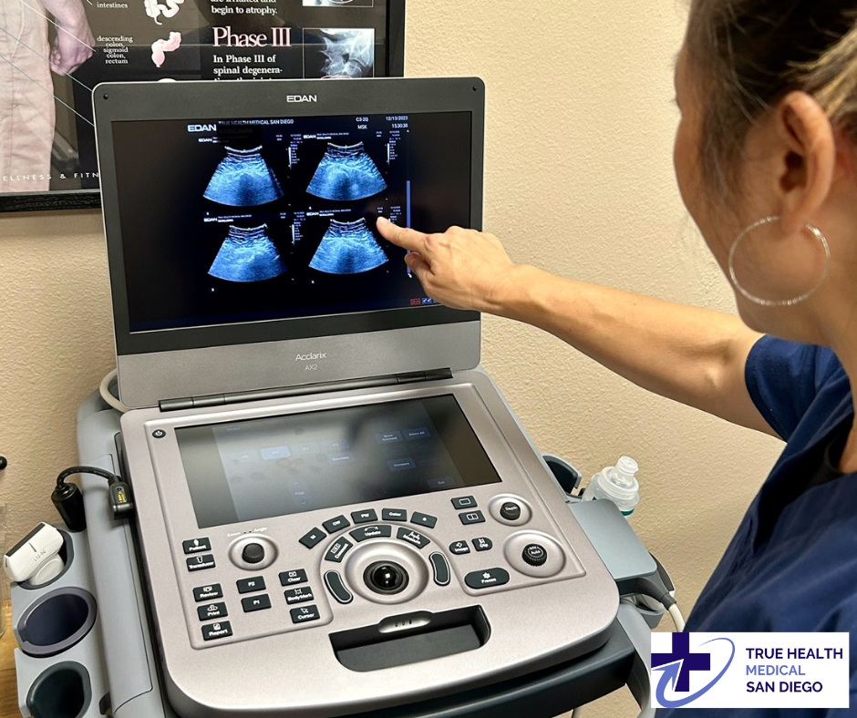 Clinician demonstrating ultrasound imaging on the Acclarix AX2 system at True Health Medical San Diego