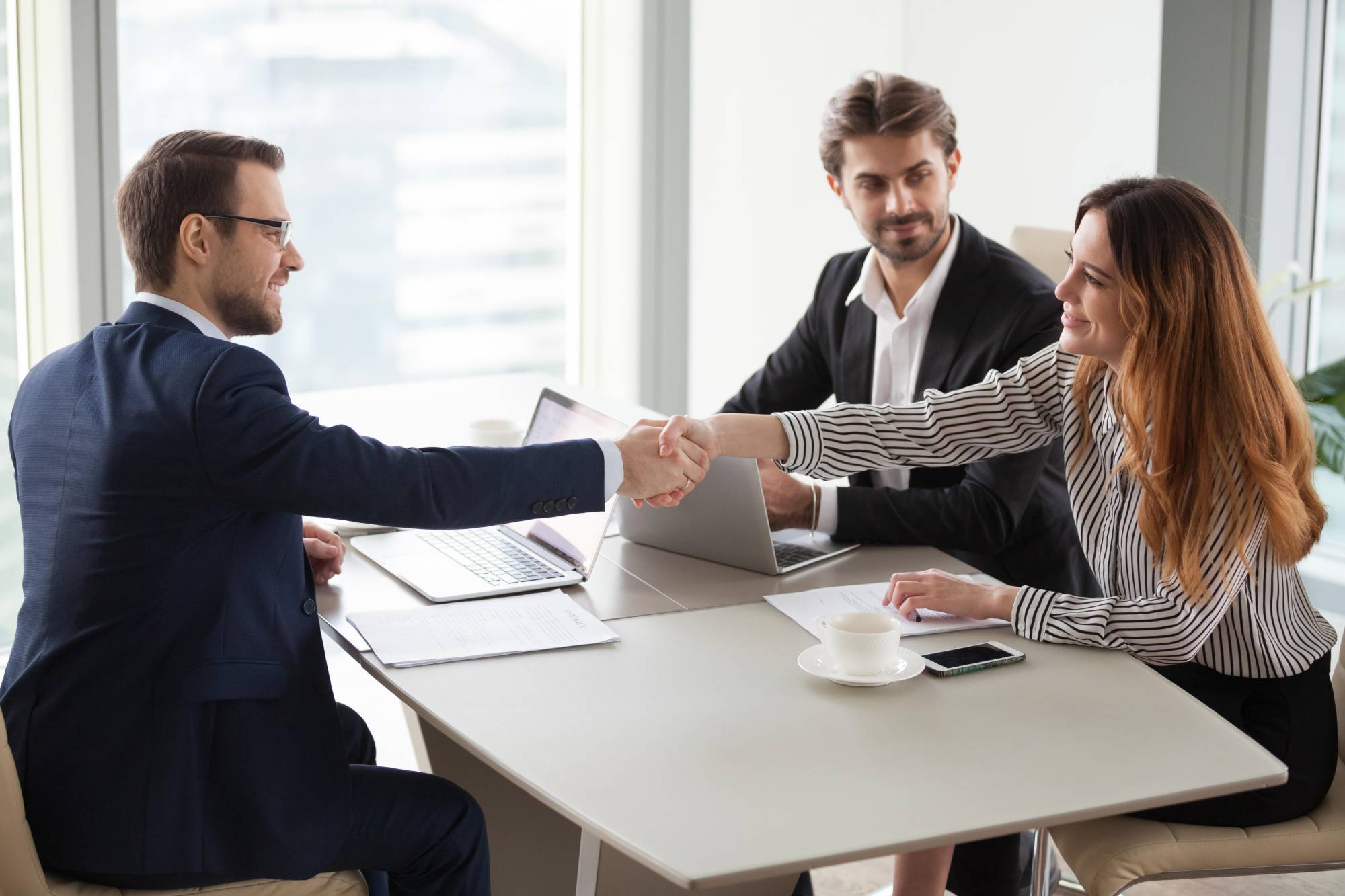 Professional bail bondsman shaking hands with clients, representing trust and reliable service in Chester County, SC
