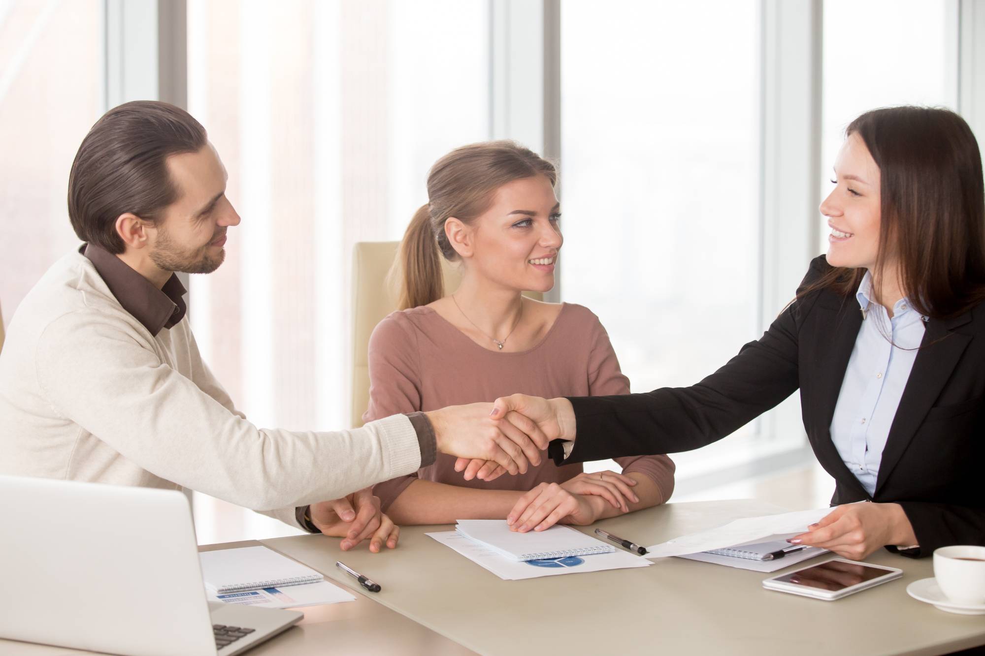Professional bail bondsman shaking hands with clients, representing trust and reliable service in Columbia, SC