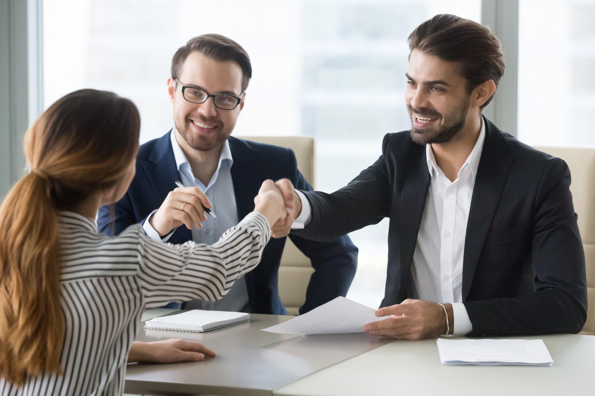 Professional bondsman shaking hands with client after arranging a bail bond in Lancaster