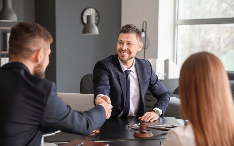 Compassionate bail bondsman shaking hands with a client in Union County