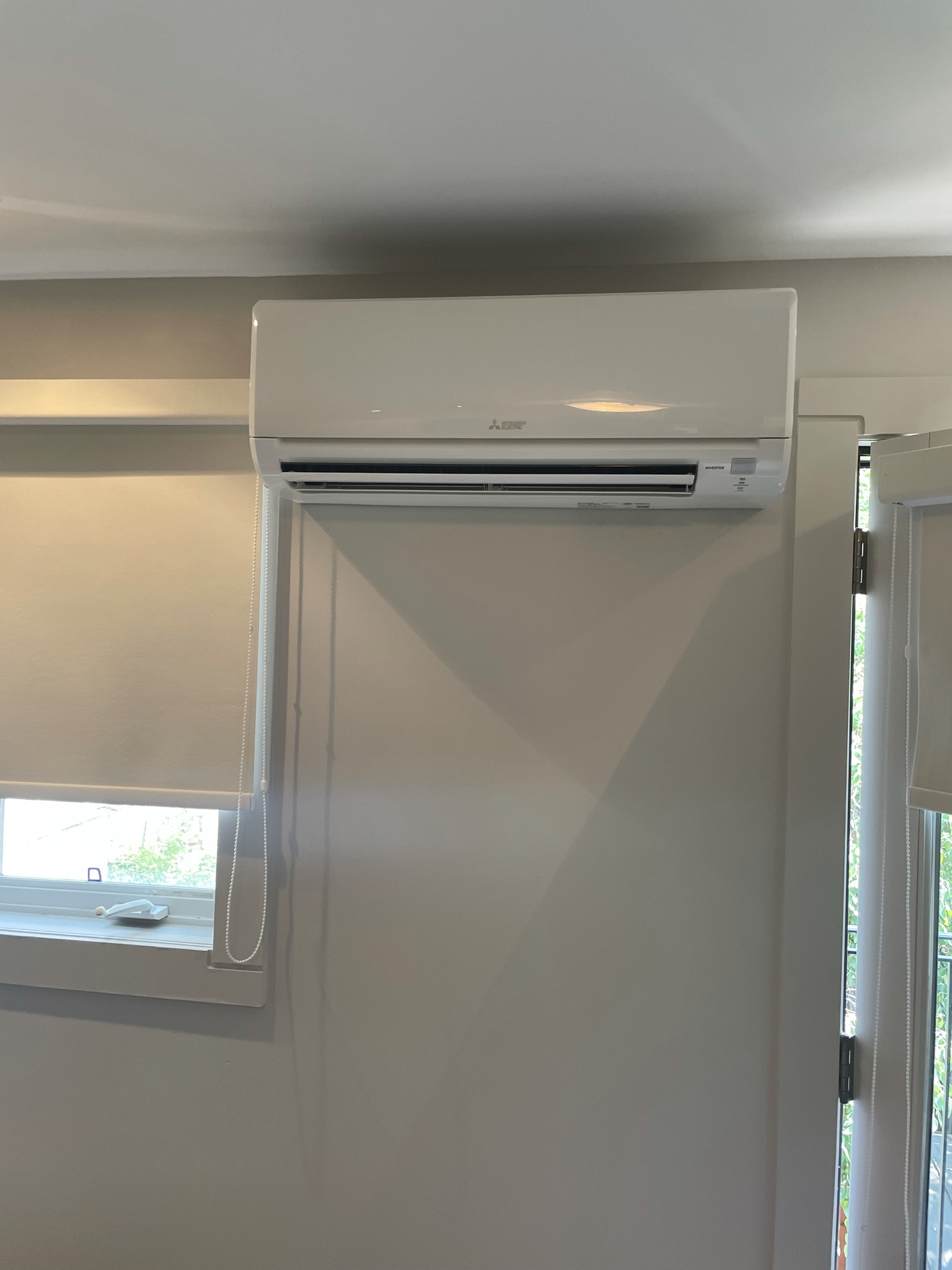 Mitsubishi ductless indoor wall unit installed in living room