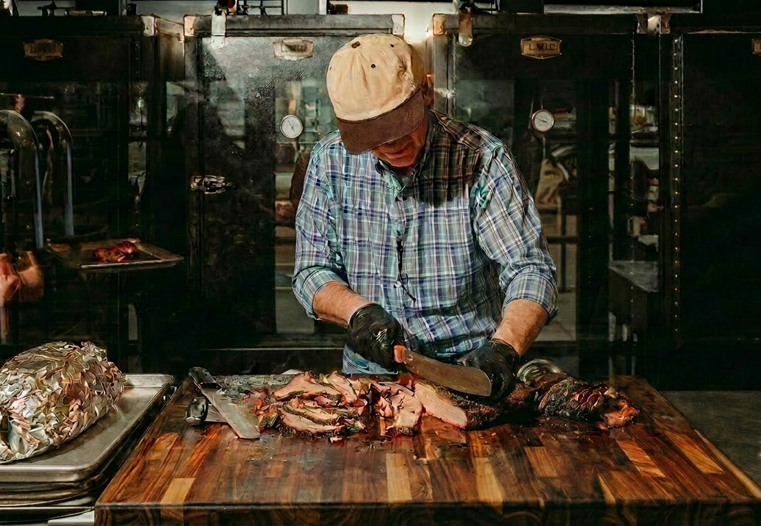 Mohamad Kharboutli slicing brisket at Levant BBQ