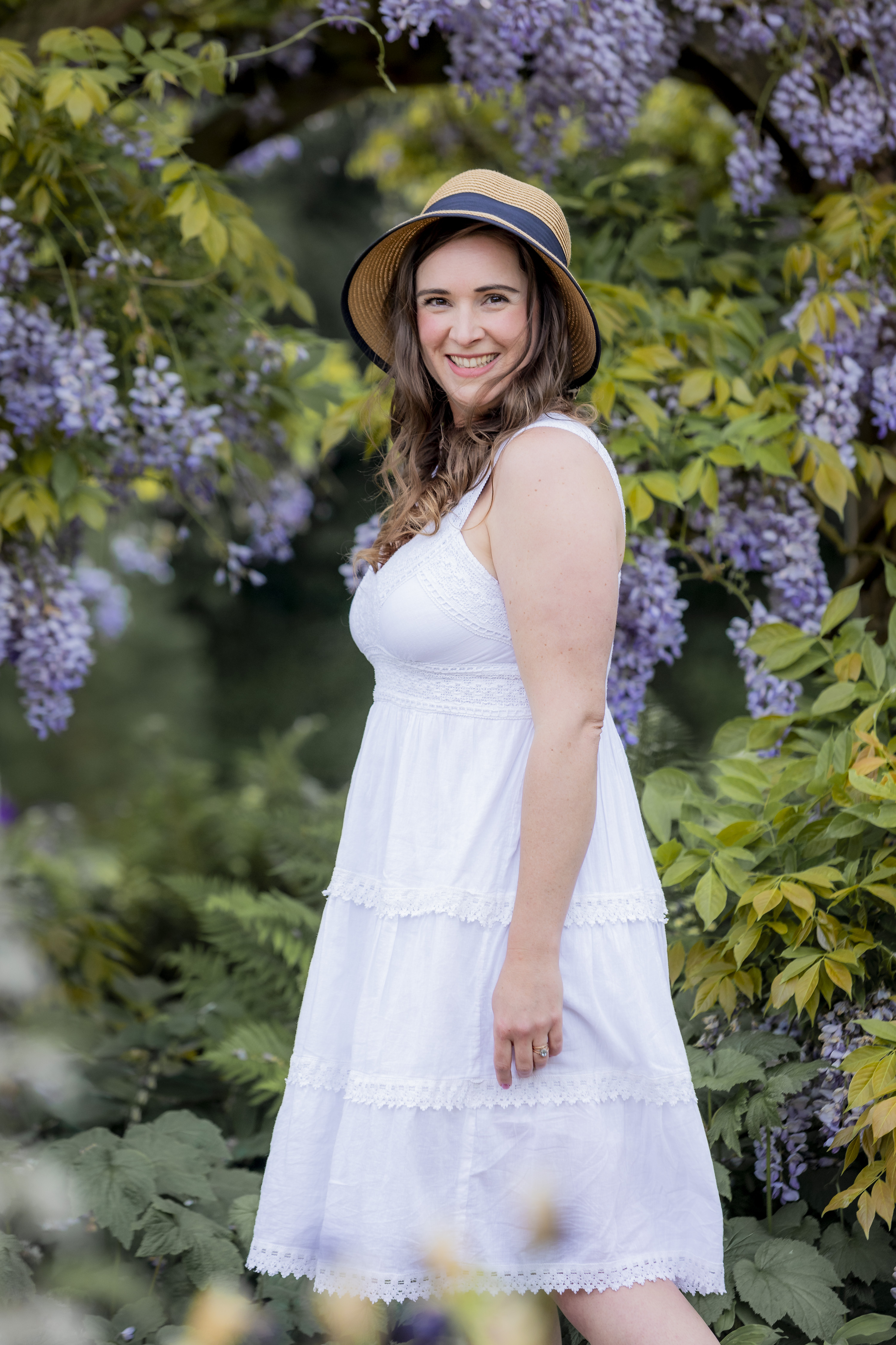 Laura Robinson among wisteria
