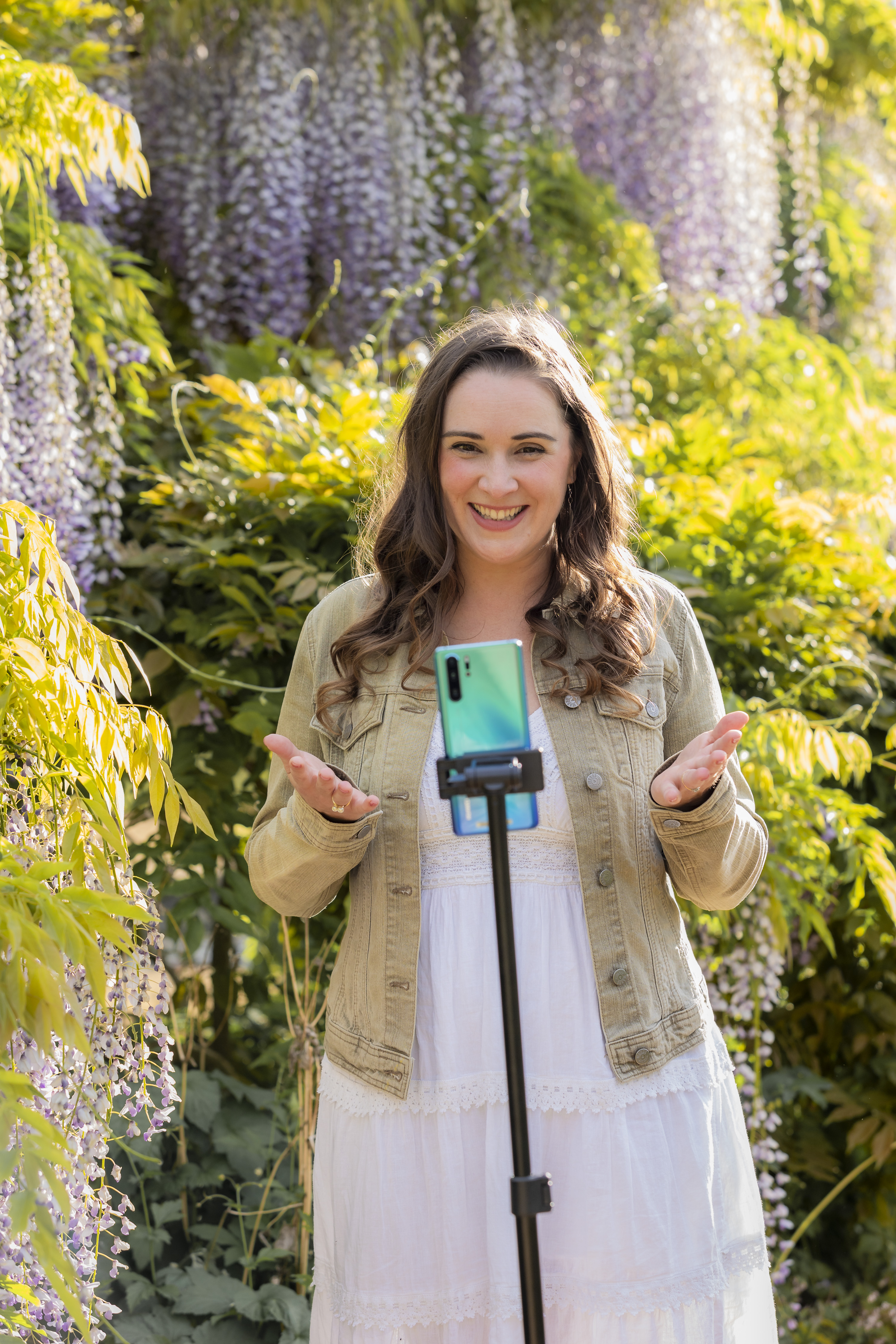 Laura dancing among wisteria