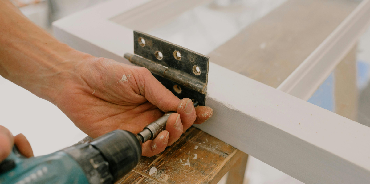 Handyman installing hardware