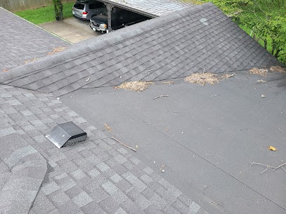 Low-slope roof transition area being prepared alongside new asphalt shingle installation on a Middle Tennessee home