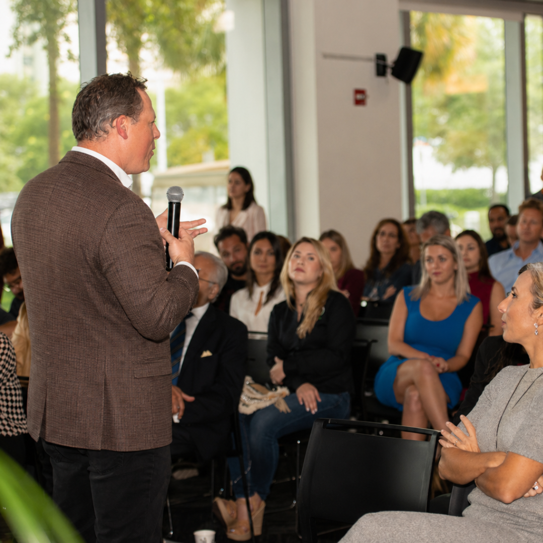 Dan Grech presenting to an audience