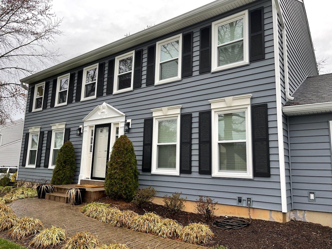 Exterior Transformation - A beautiful combination of fresh siding, new roof, and updated windows.