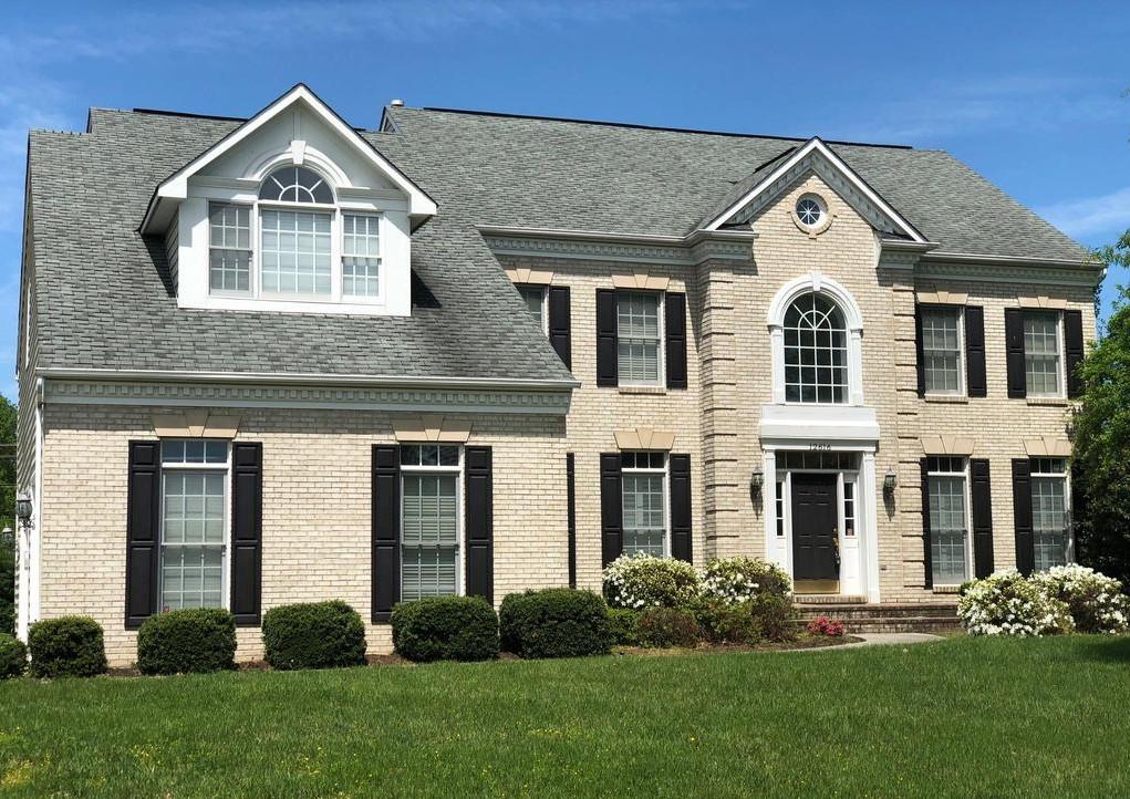 Custom Window Installation - Beautiful new energy-efficient windows installed to perfectly complement this classic brick home.