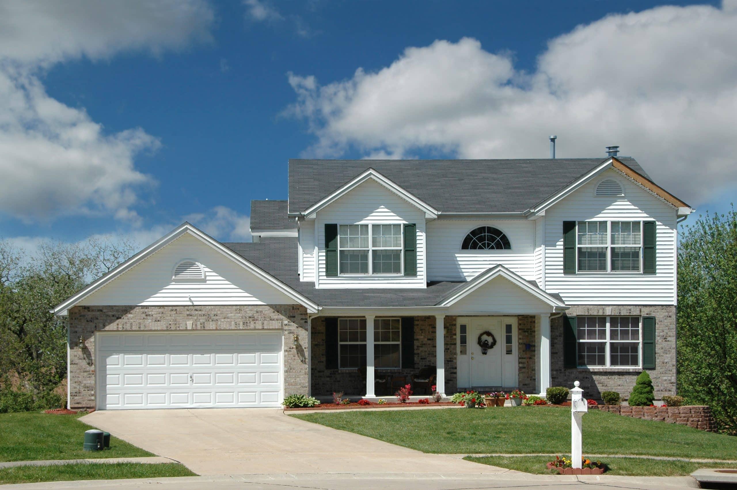 White Siding & Roofing - A beautiful combination of fresh white siding, new roof, and updated windows.