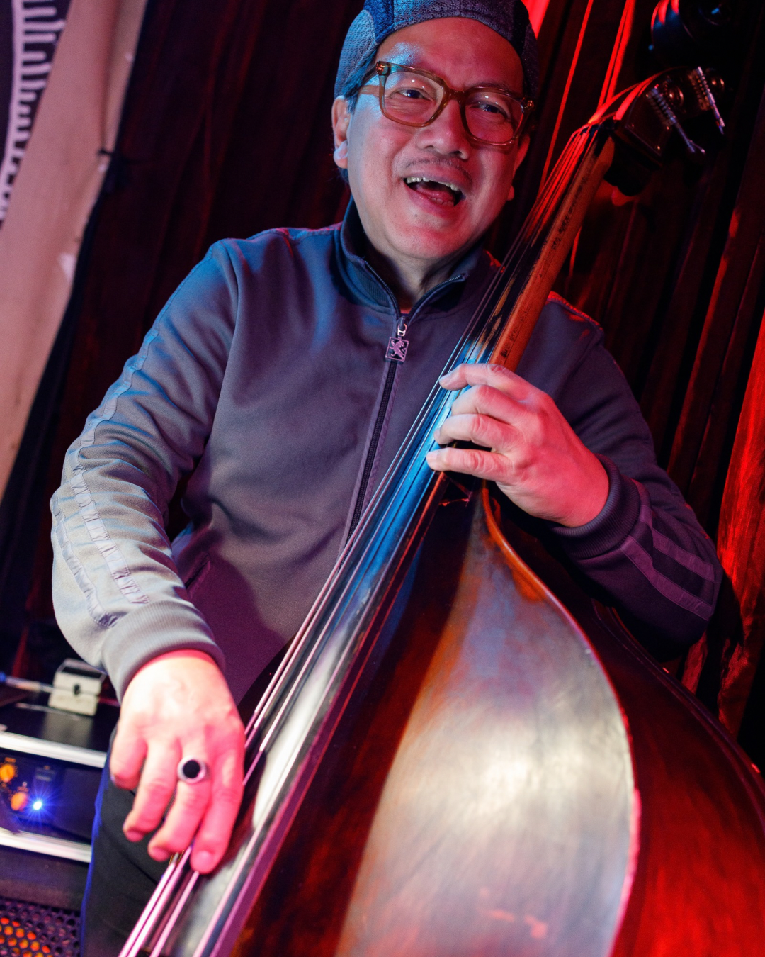 Live acoustic jazz bass musician performing on stage