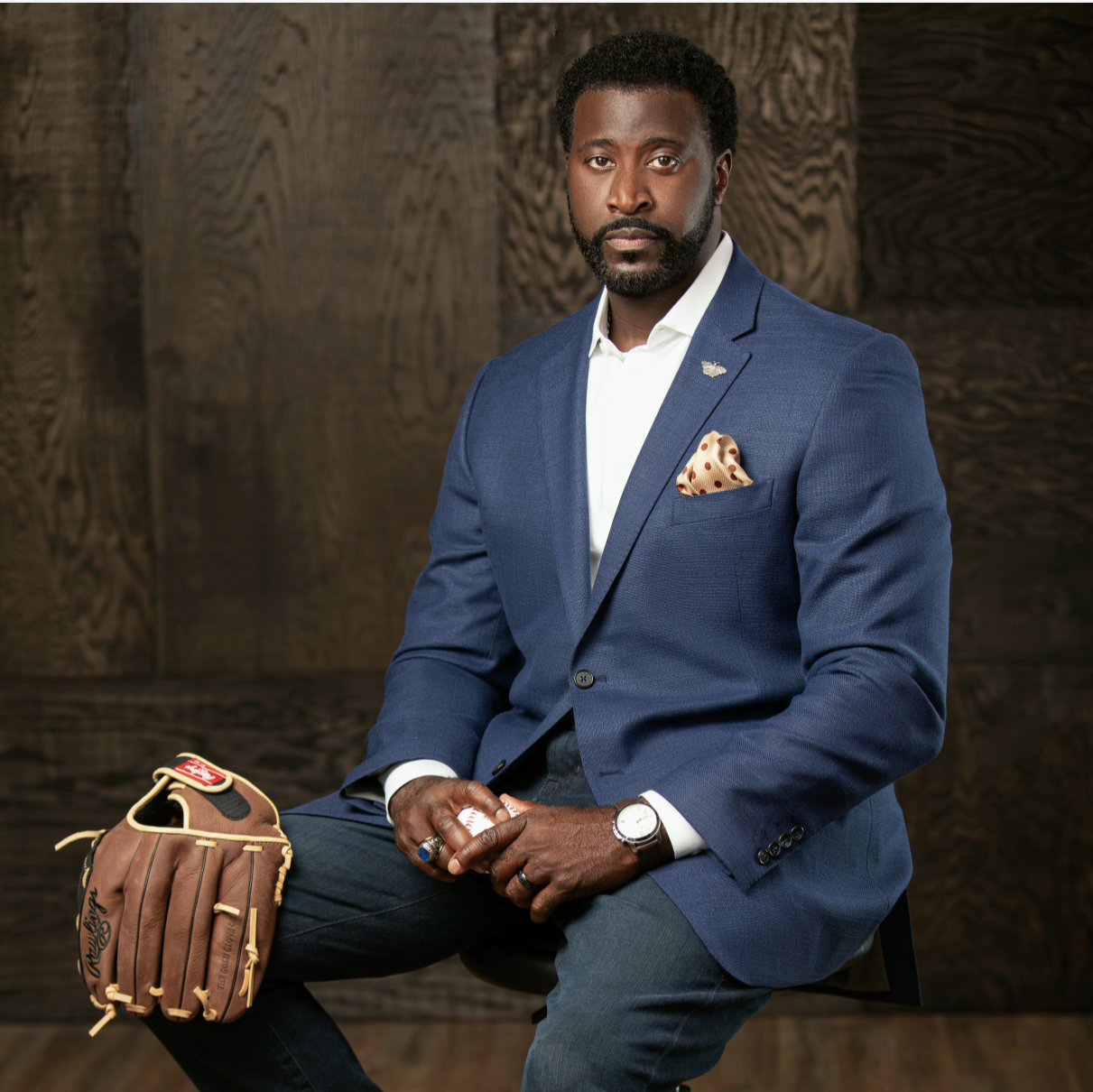Jimmie C. Gardner in blue suit holding baseball glove