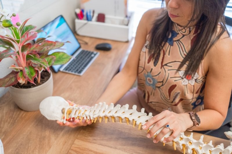 Dr. Liz demonstrating spine model