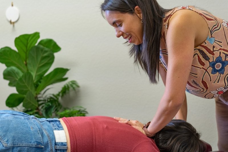 Adult receiving chiropractic care