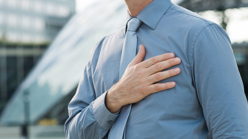 Closeup Of A Businessman With Hand On His Chest Outdoor