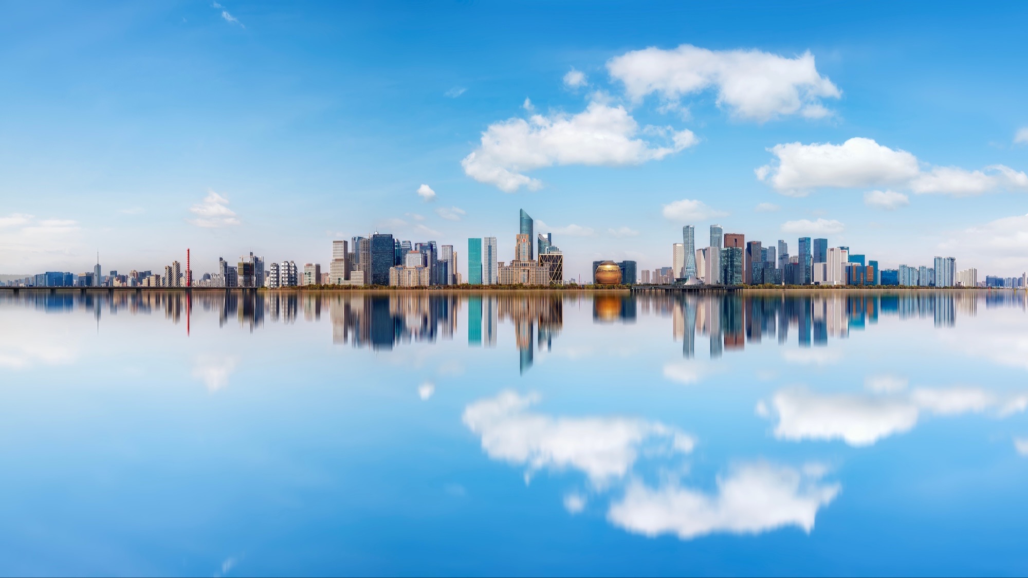 Modern skyline reflected in water