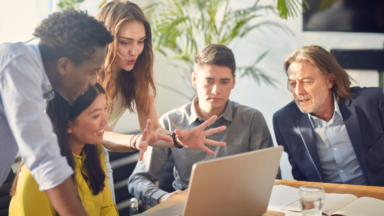 Woman business leader coaching and mentoring her team members