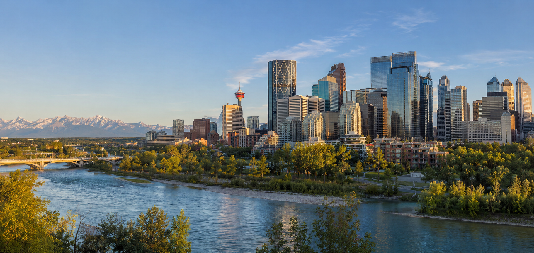Calgary downtown skyline, Calgary Tower and Bow River with the Rocky Mountains in the distance.