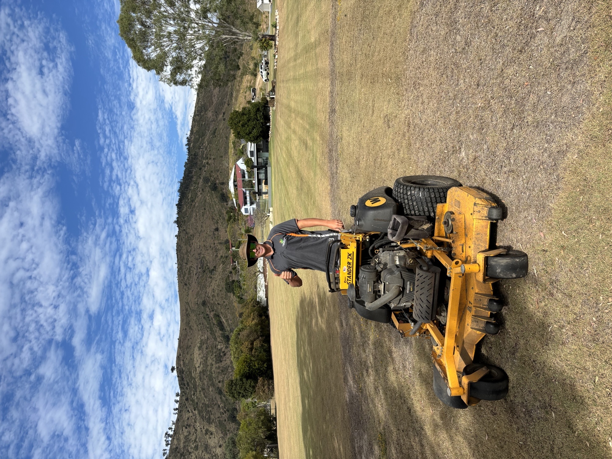 Ride on mower cutting large acreage block in Caboolture