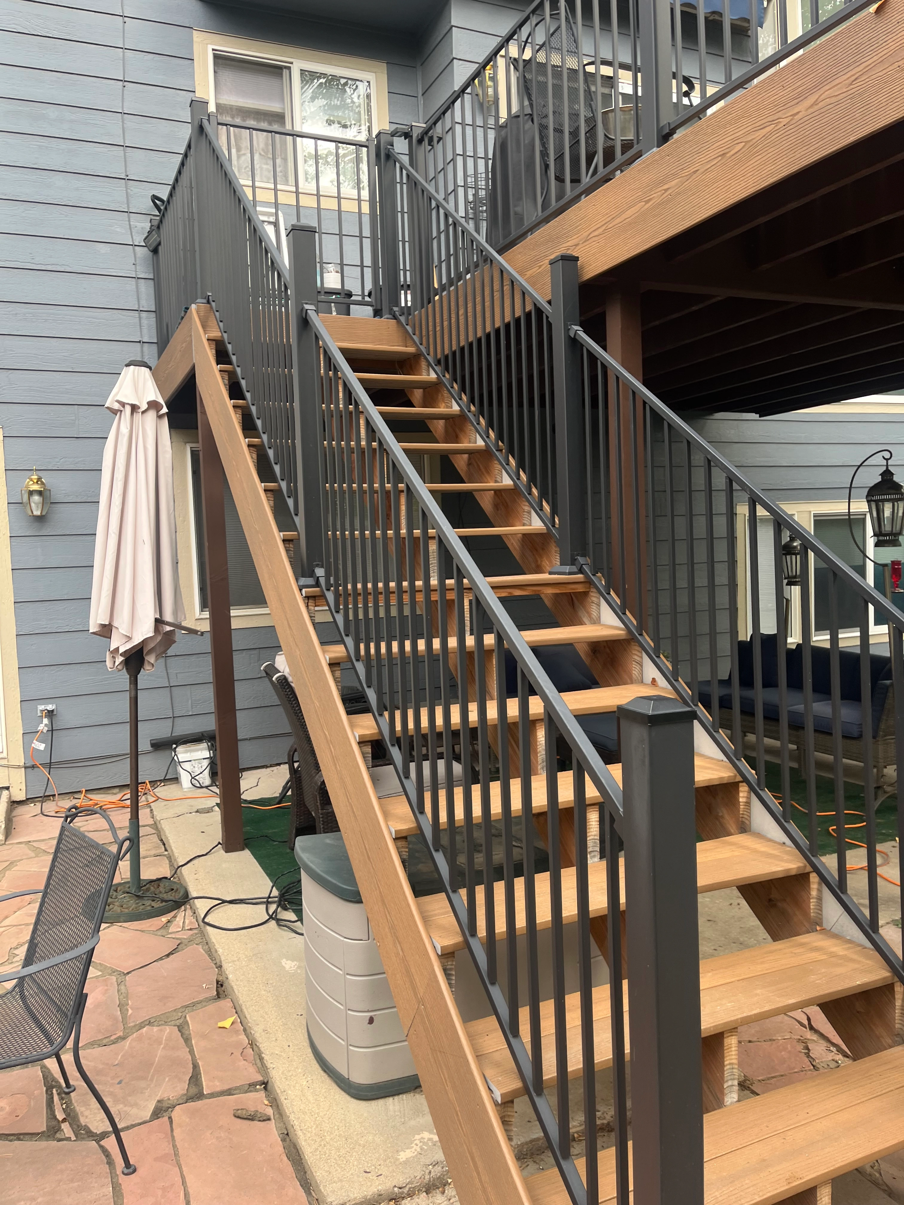 Custom deck stairs and modern black aluminum railing