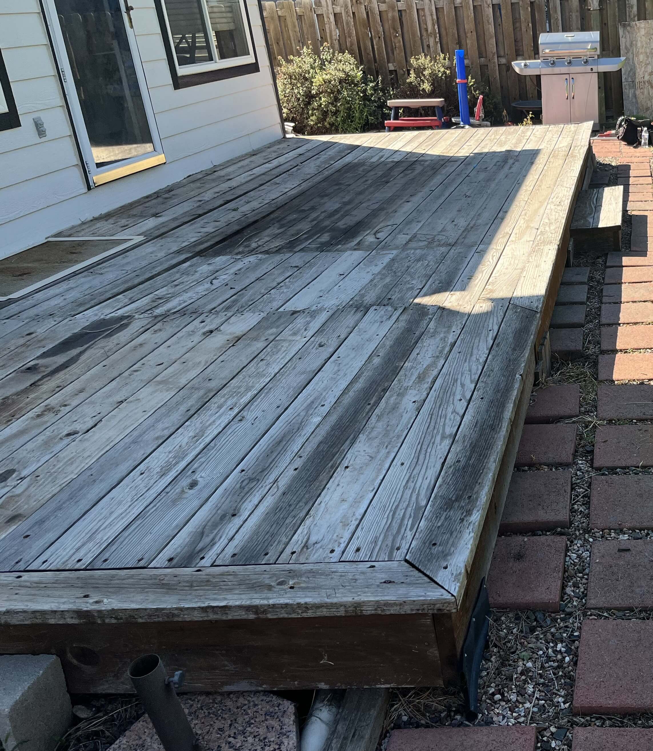 October project 1 before - weathered deck surface and perimeter view
