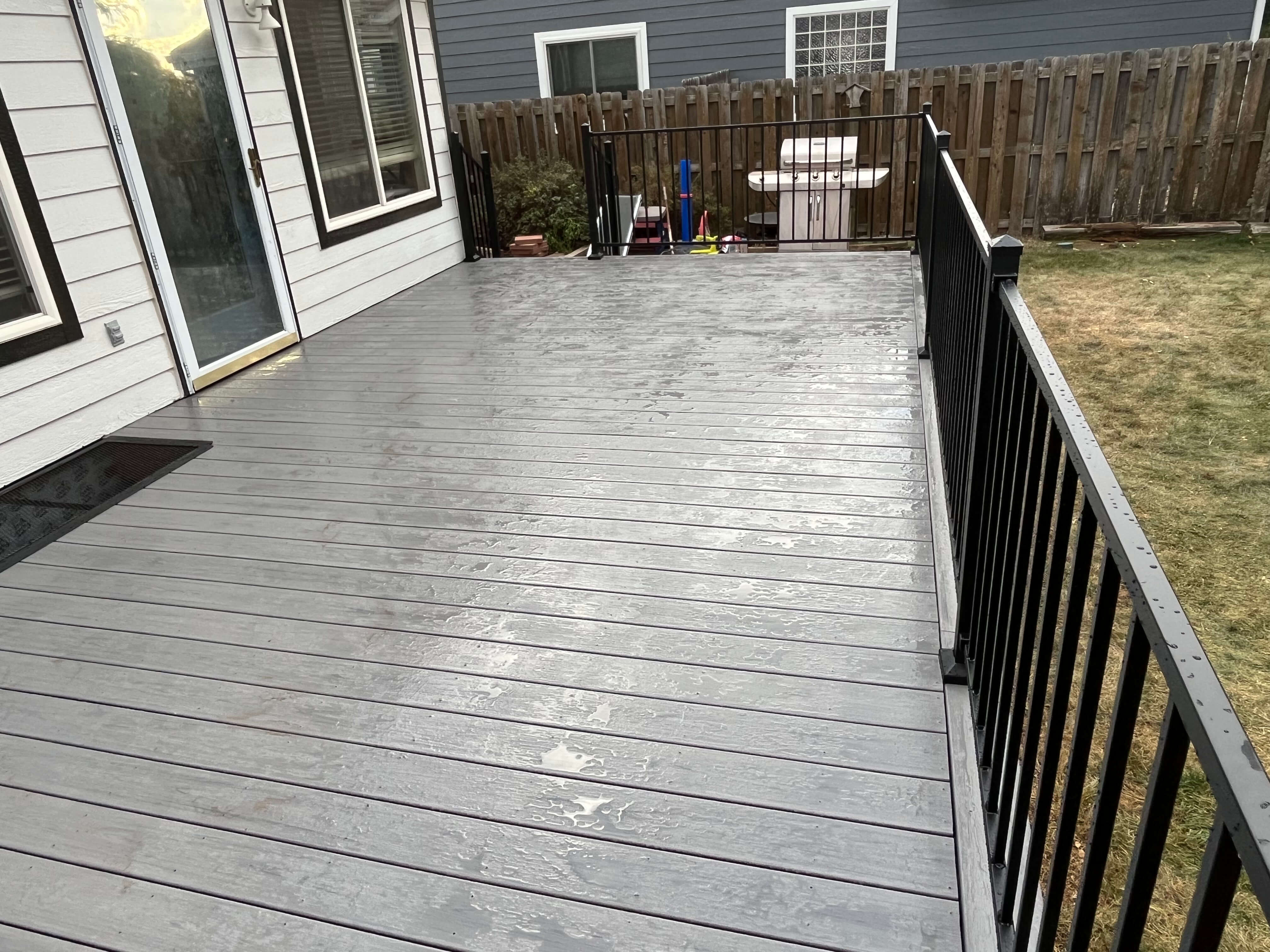 October project 1 after - finished deck surface with black railing