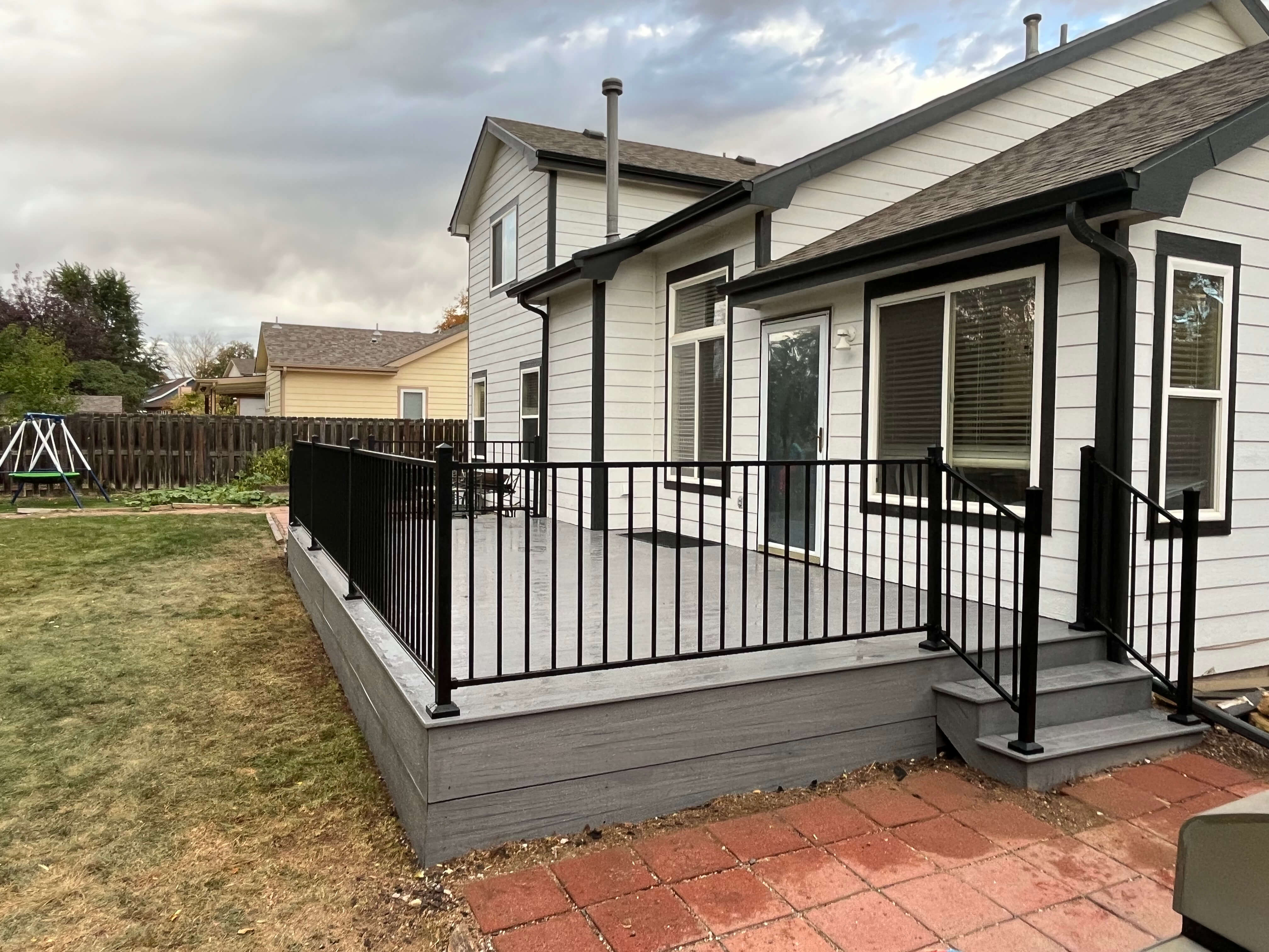 October project 1 after - side angle with custom steps and perimeter fascia