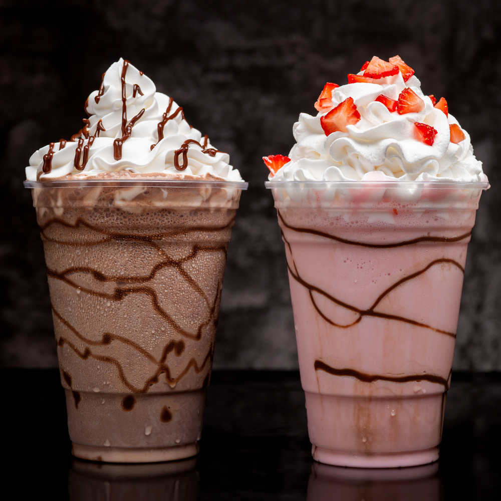 Chocolate and strawberry milkshakes with whipped cream at Coffee and Dreams Adelaide CBD