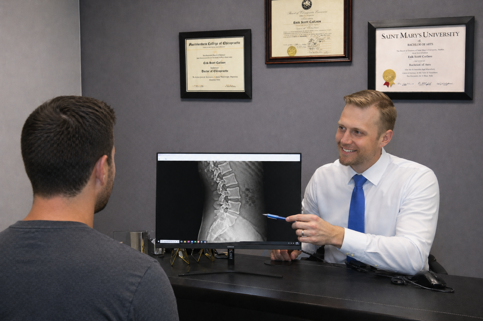 Doctor and patient reviewing x-rays
