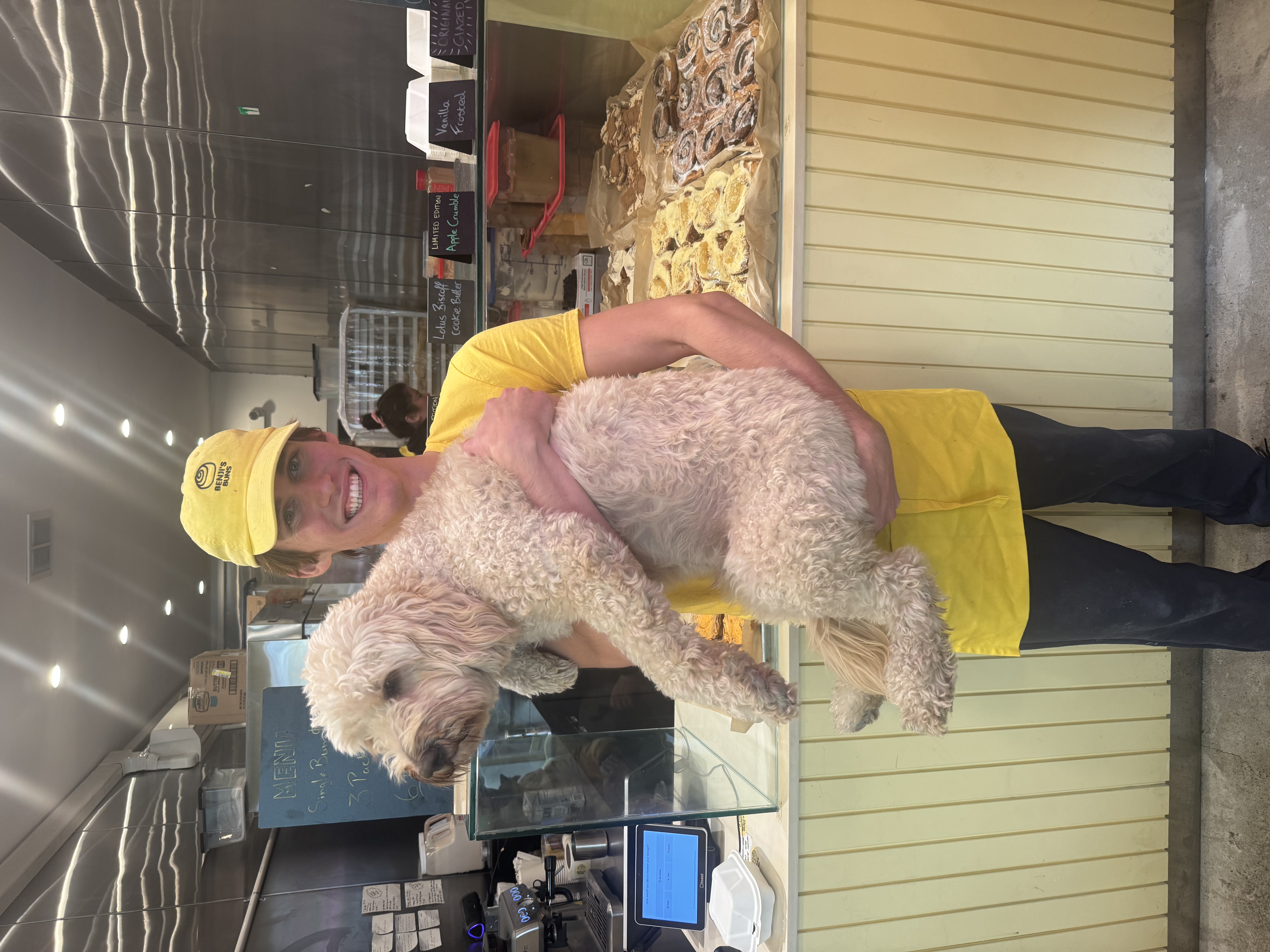 Benji holding dog