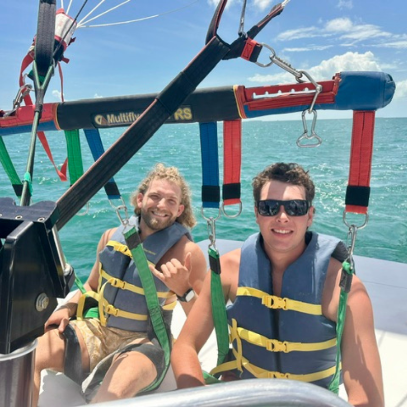 Two guys ready to parasail