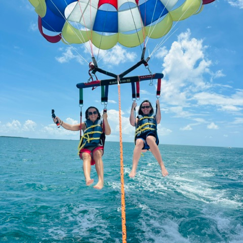 Two people parasailing