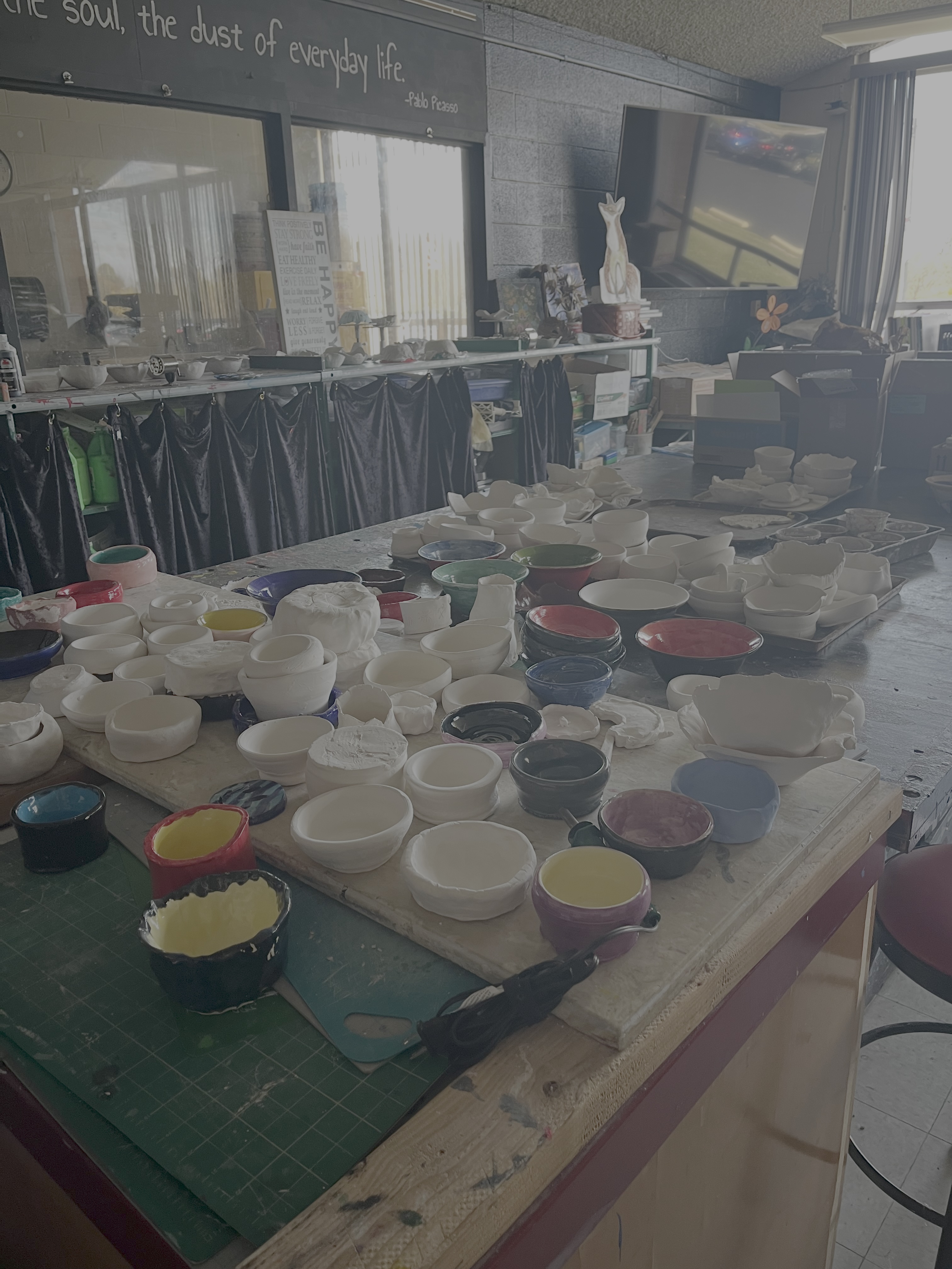 Students making ceramic clay bowls in an art class