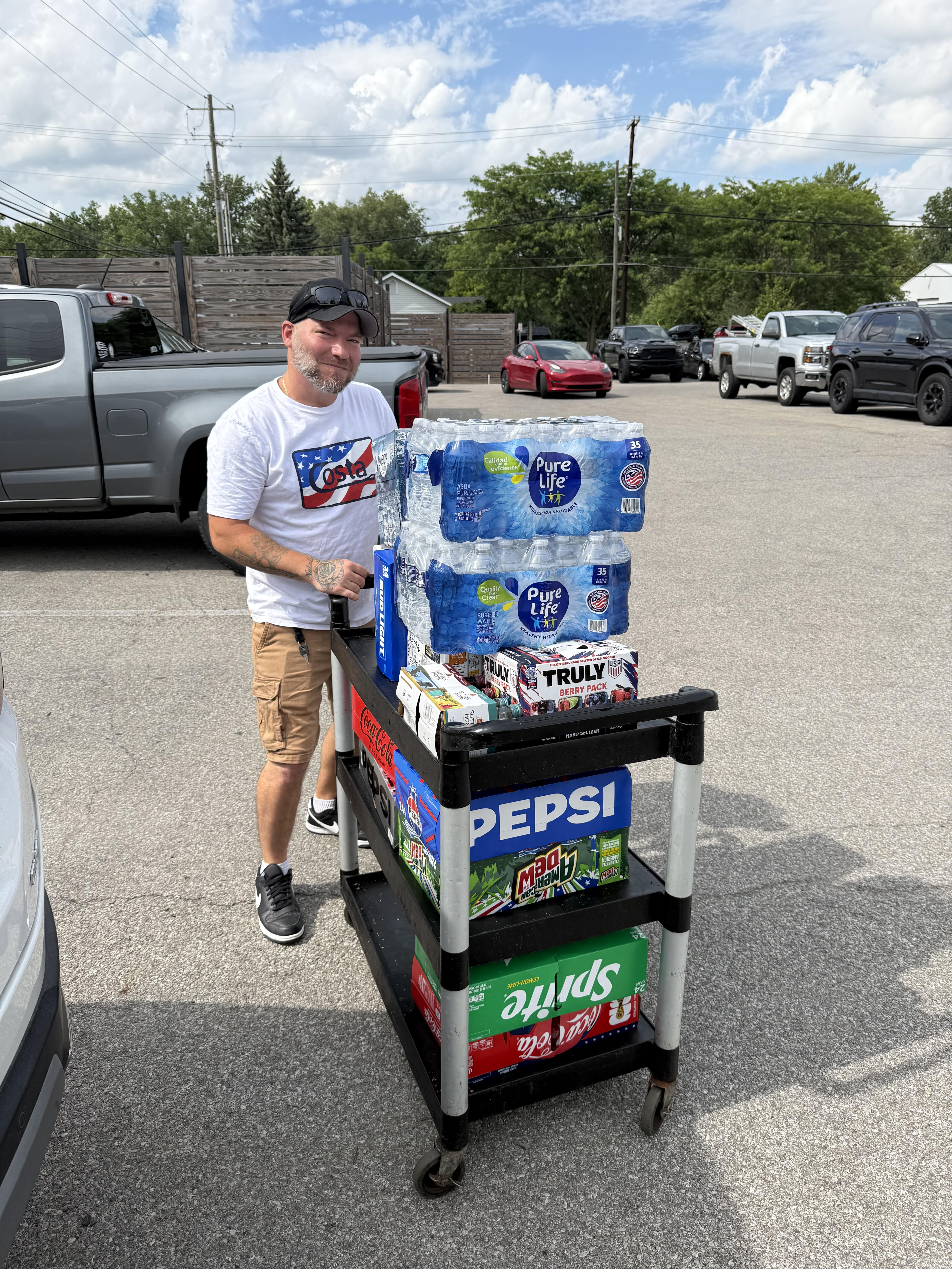 Volunteer delivering drinks