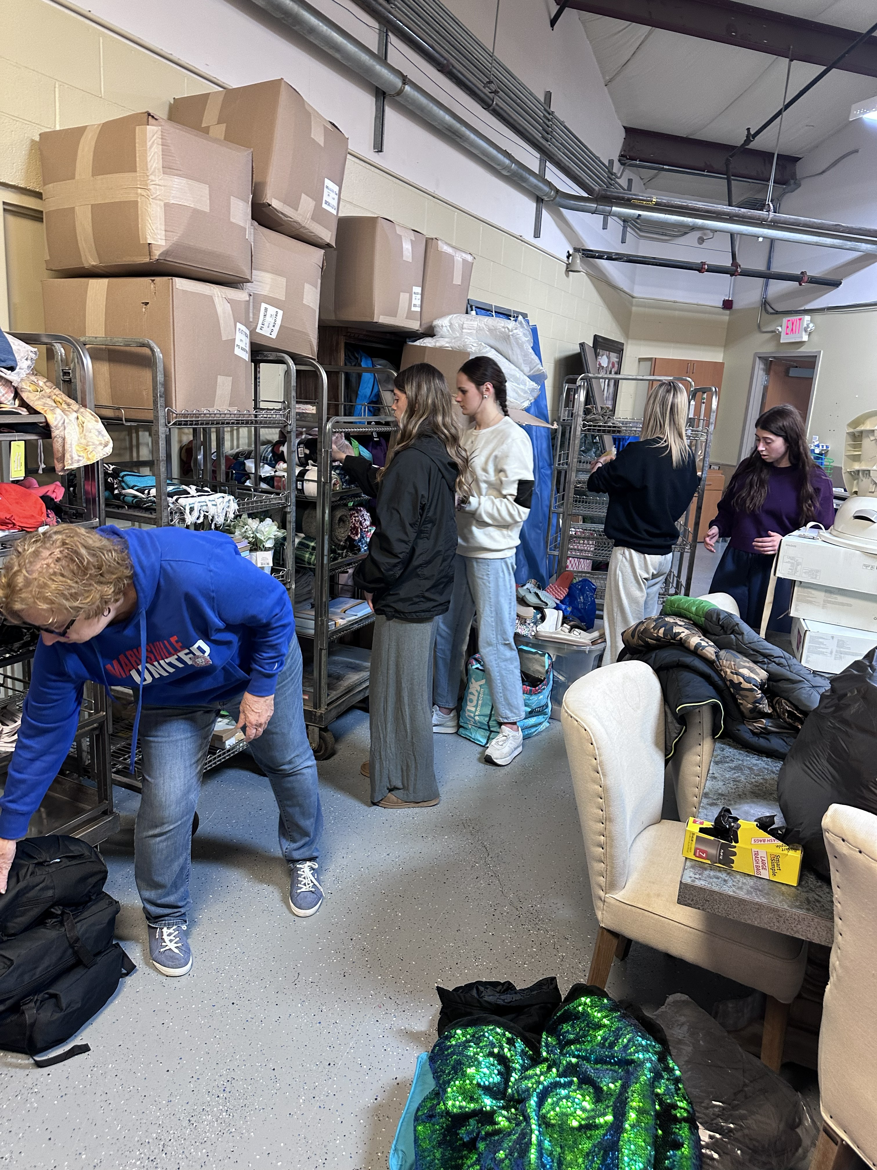 Volunteers sorting donations