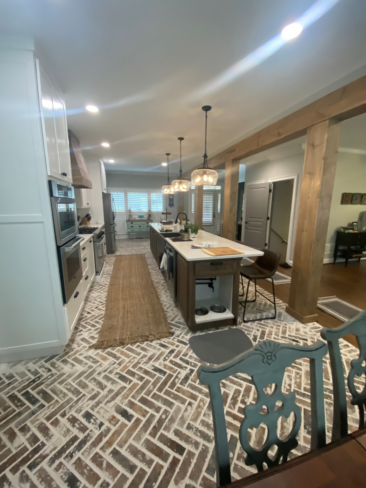 Kitchen remodel after renovation with island and brick floor Cartersville GA