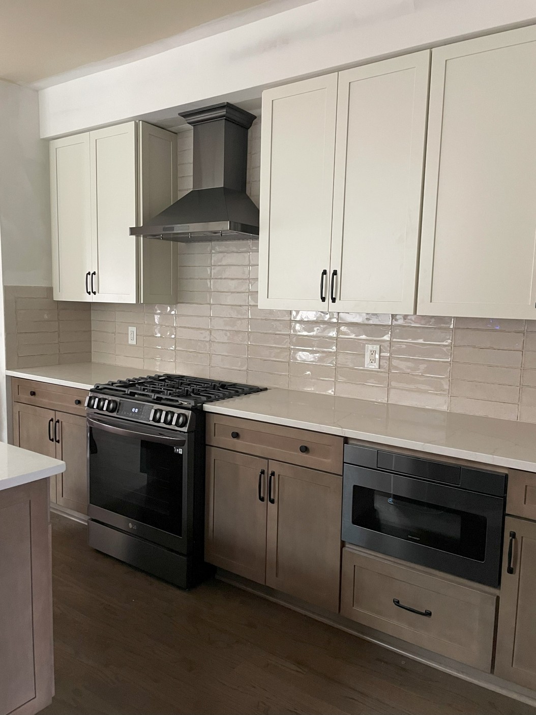 Custom kitchen remodel with modern range hood, cabinets, and backsplash Cartersville GA
