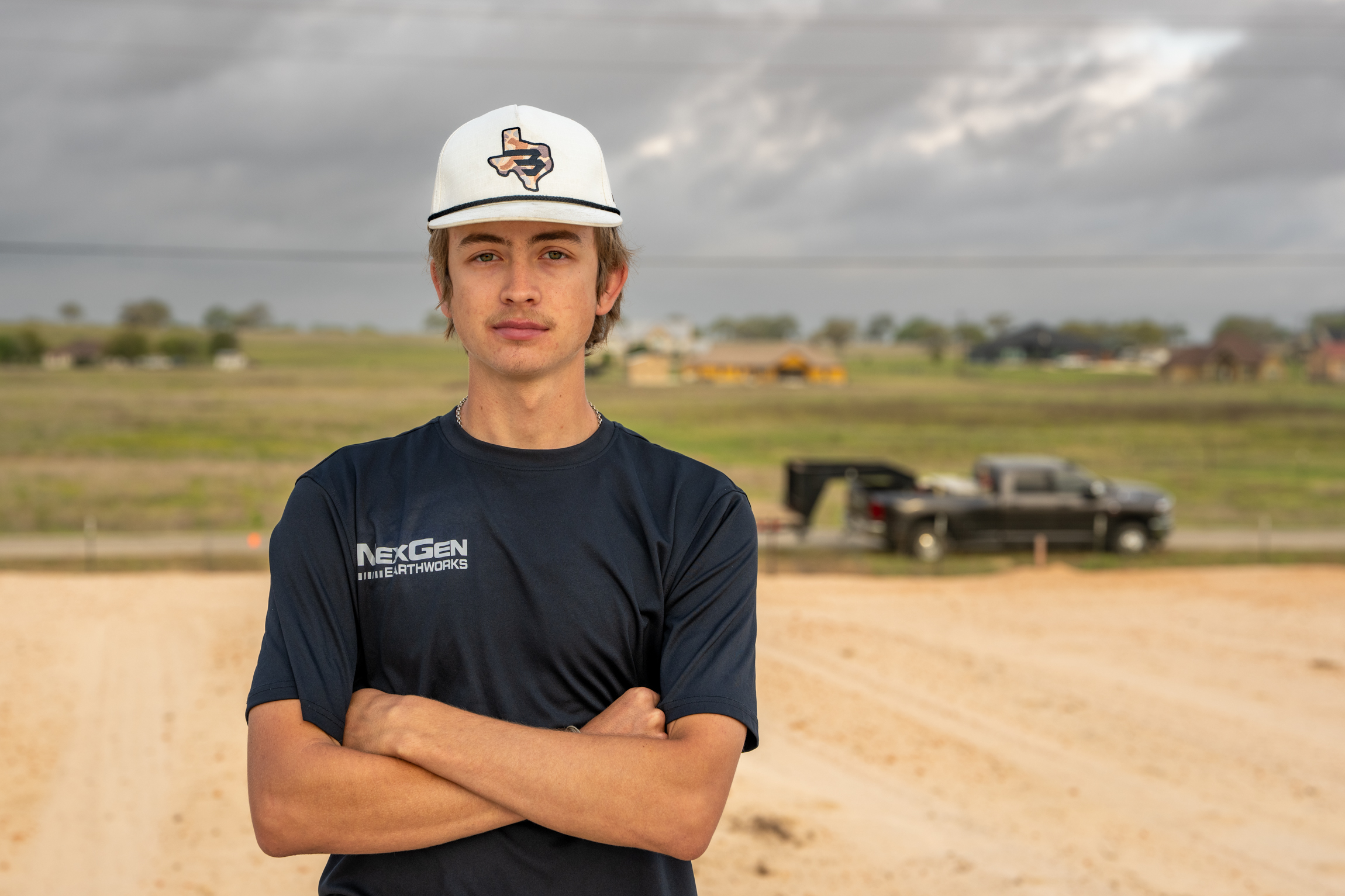 Caiden Friederick, owner of NexGen Earthworks, on site with equipment