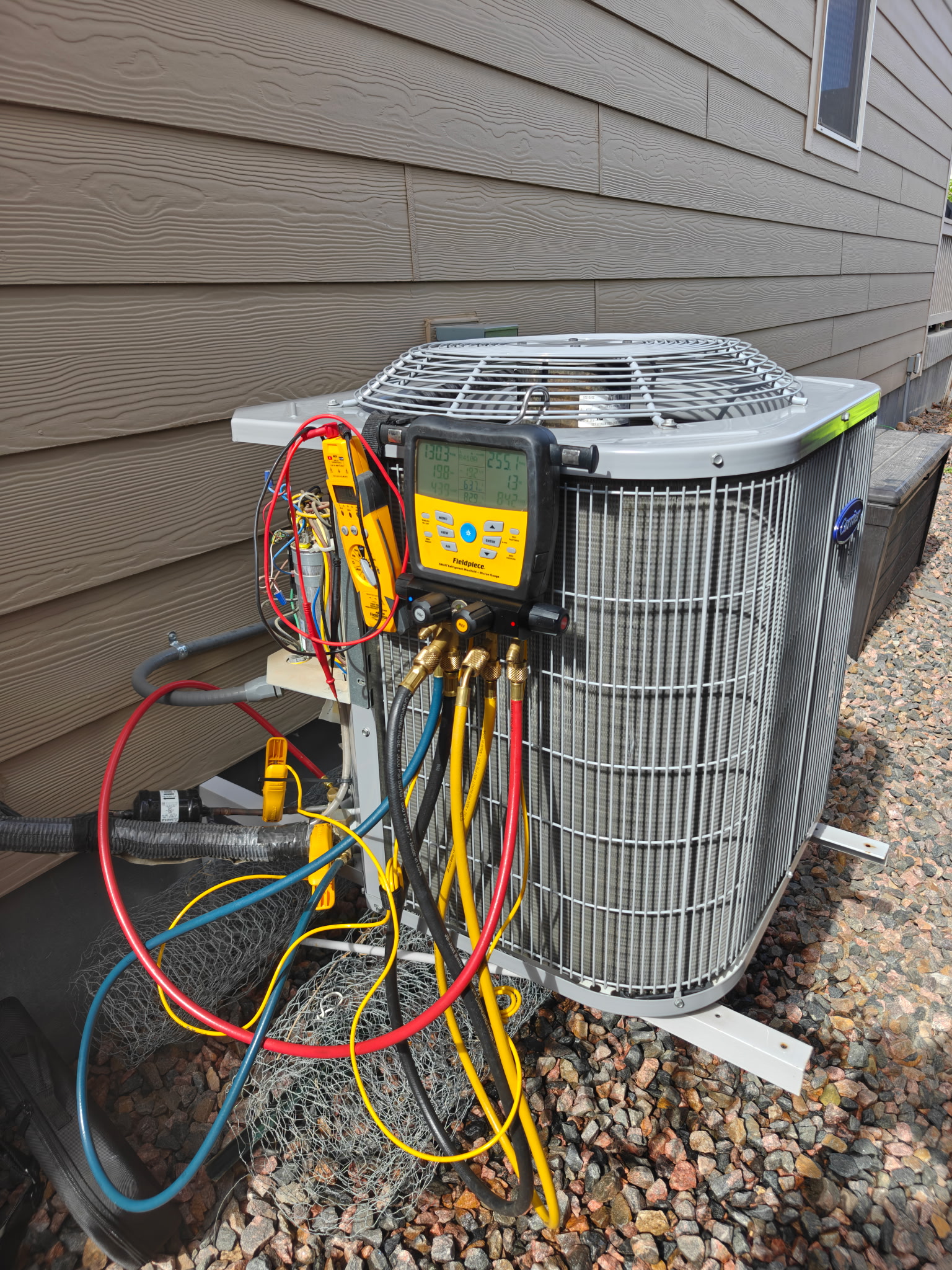 Icon Heating & Air Servicing AC Unit