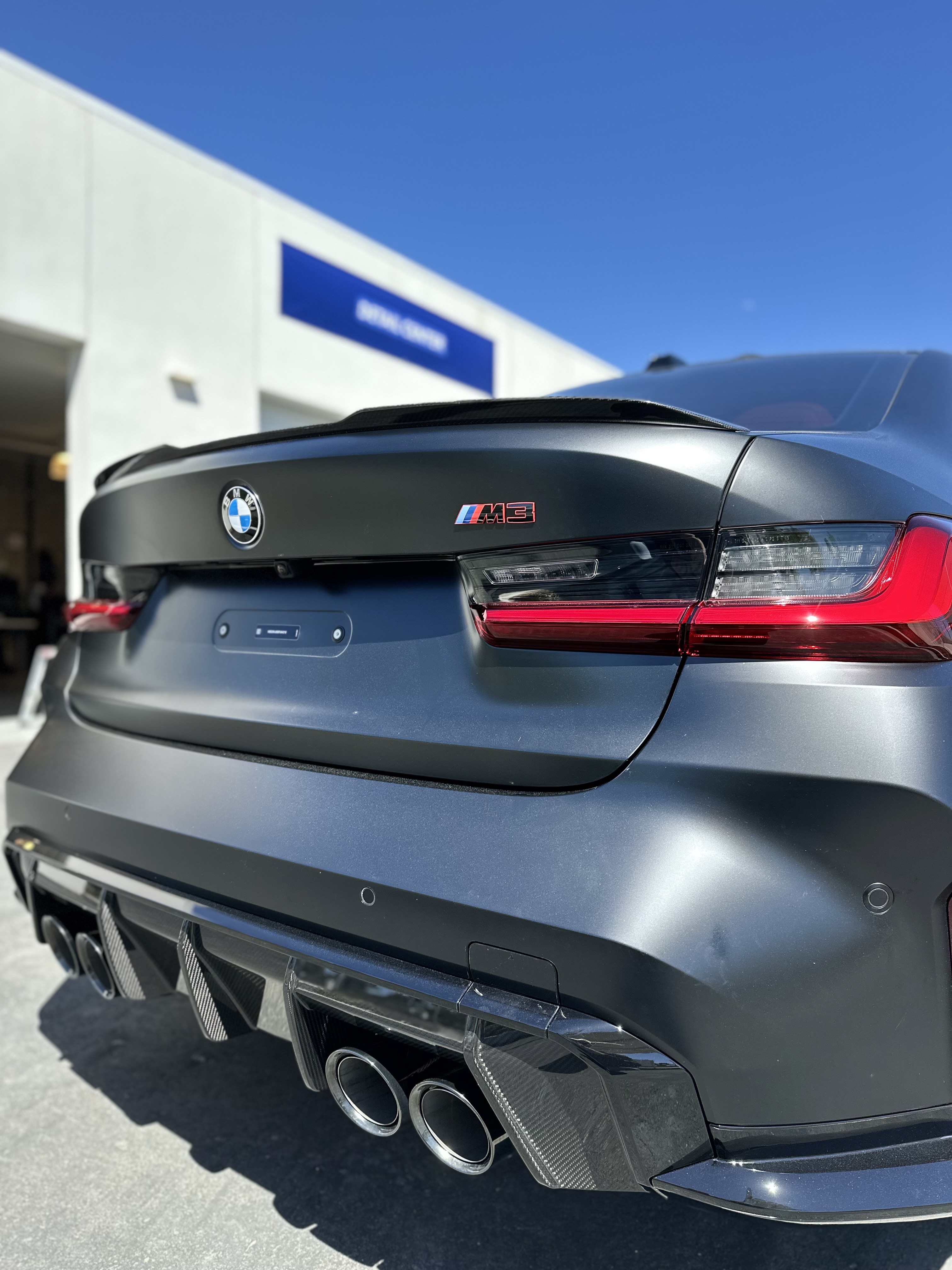 Matte Black BMW M3 Rear Profile Riverside