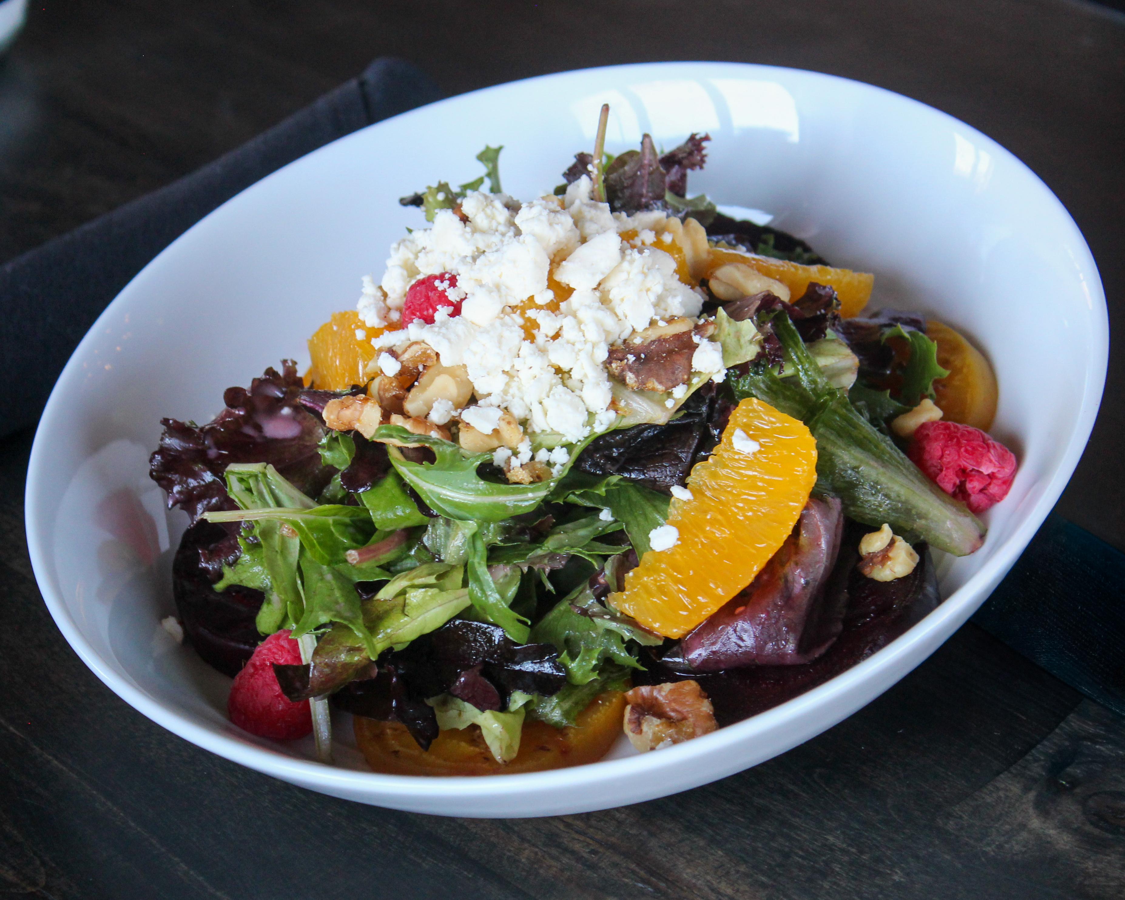 Roasted Beet Salad with mixed greens, fresh berries, and feta
