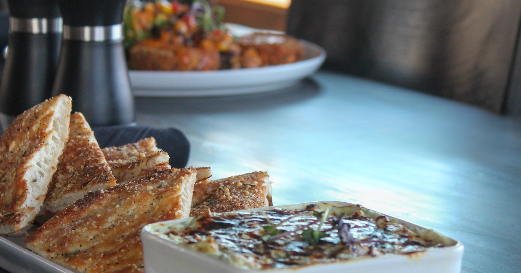 Delicious appetizer spread with flatbread and dip