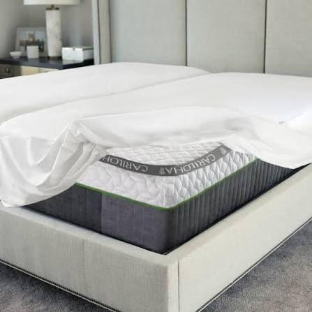 Cariloha Signature 5-Sided Mattress Protector pulled back to show mattress corner