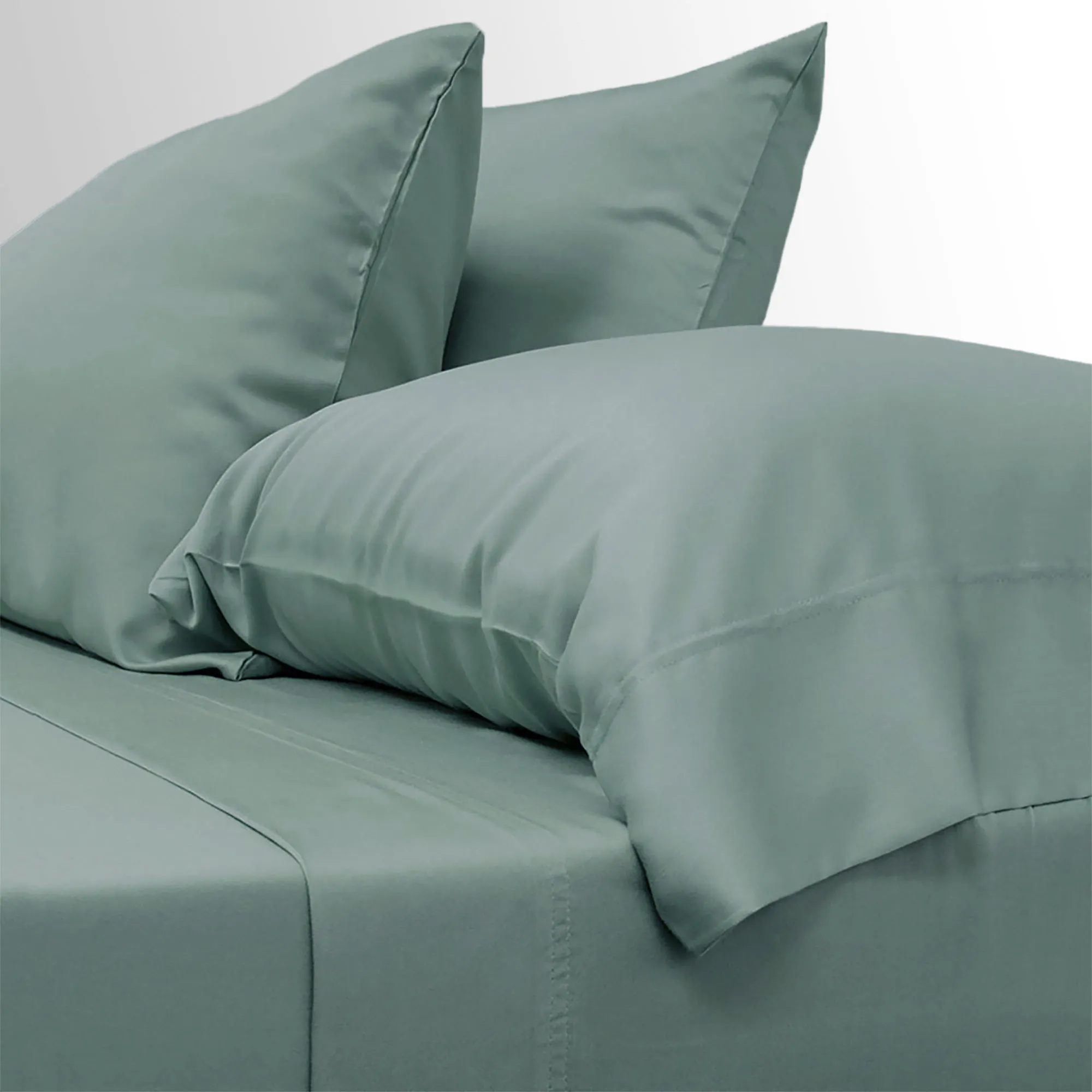 Cariloha Aloha Soft Bamboo Sheet Set in sage green on a bed