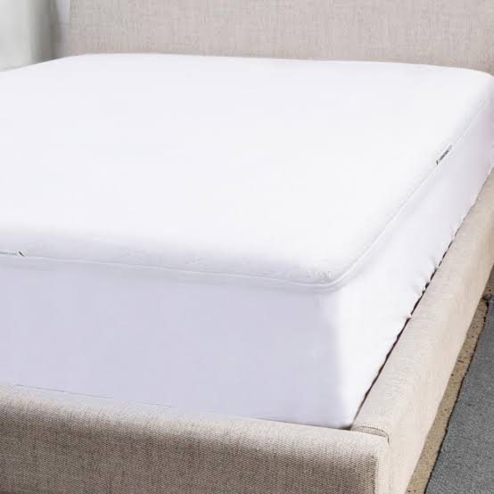 Cariloha Aloha Soft Mattress Protector, smooth white cover on bed