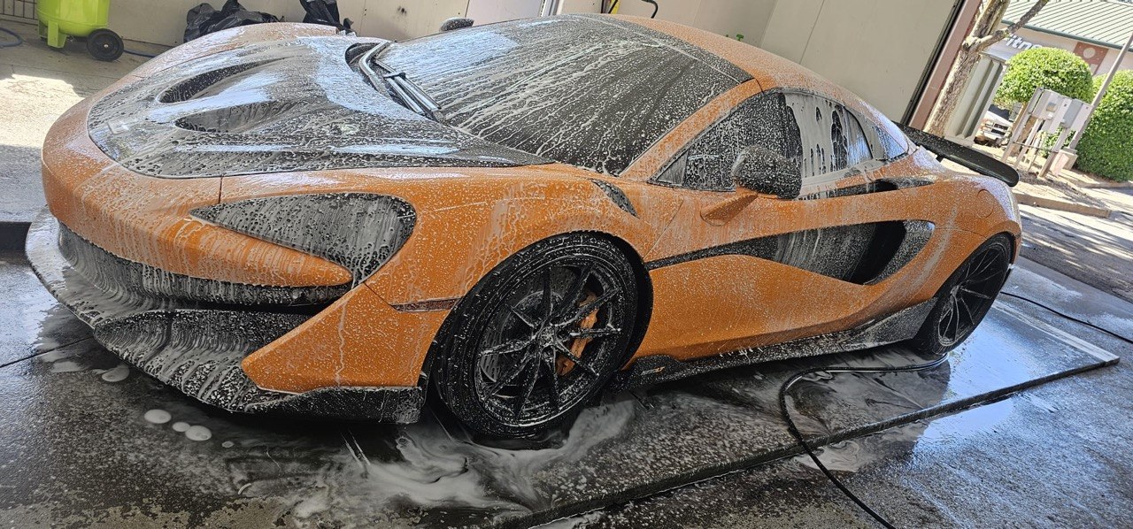 Orange McLaren getting washed