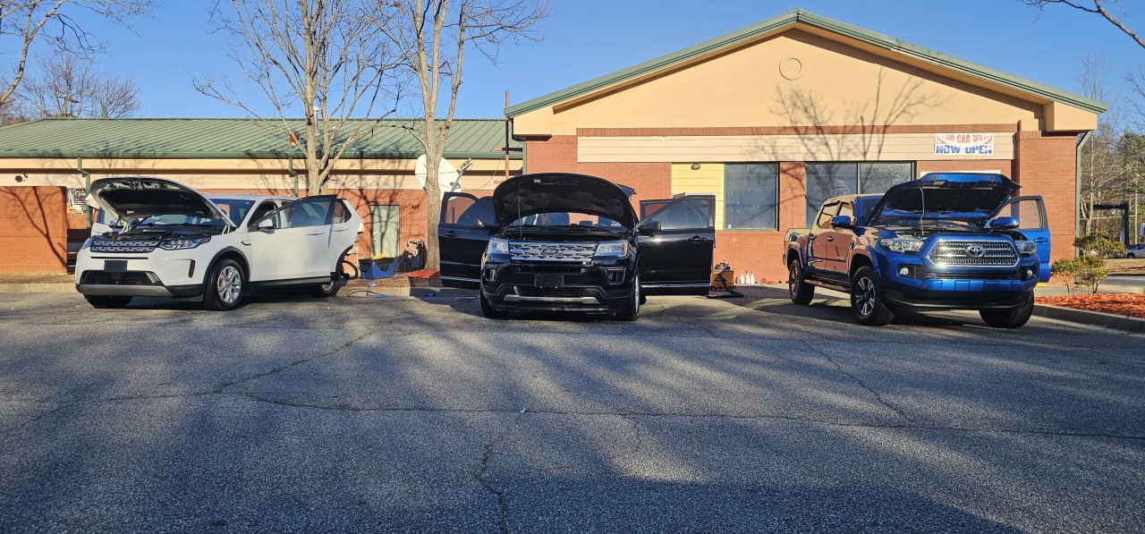 The three vehicles with hoods open