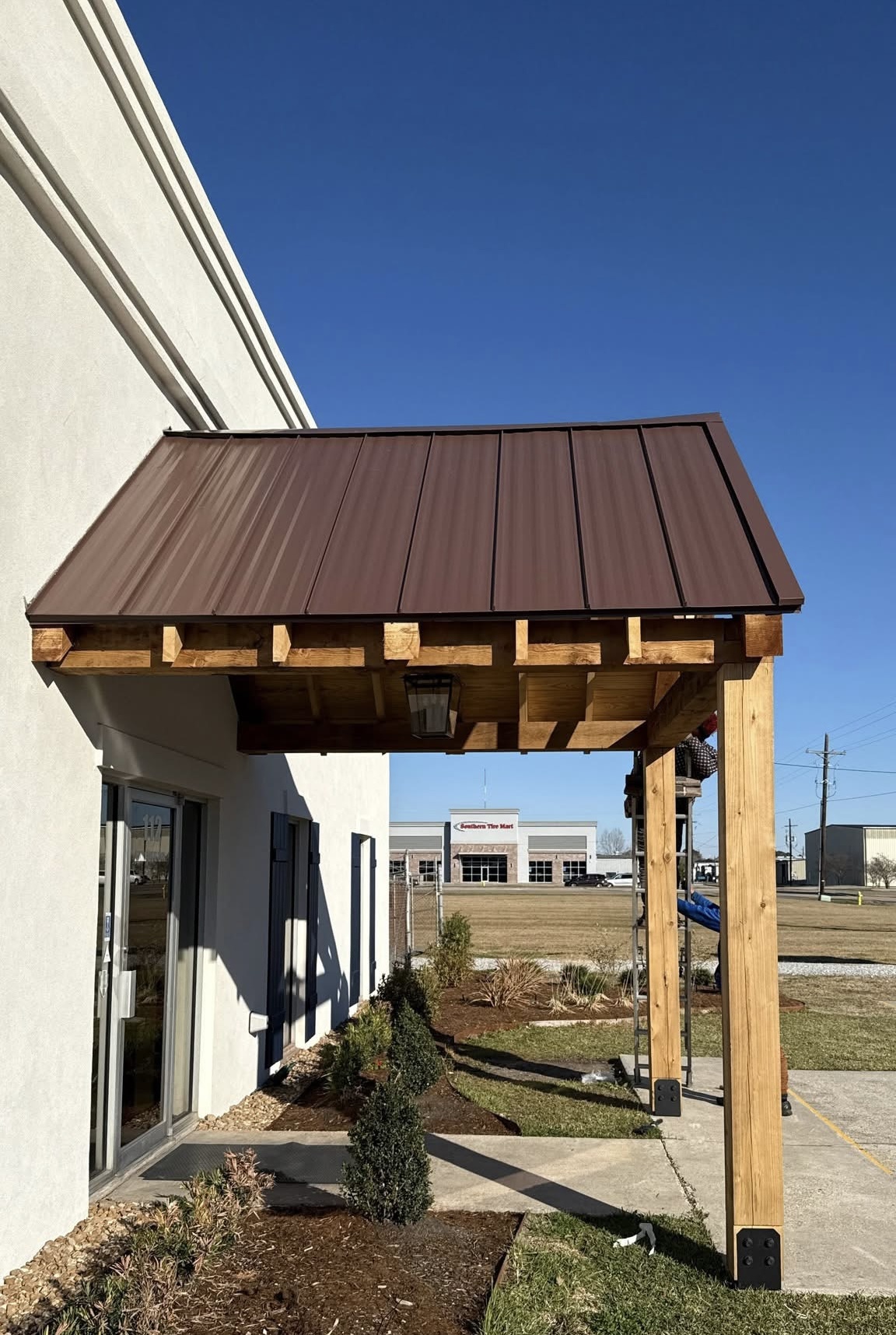 Standing seam metal awning installation in South Louisiana